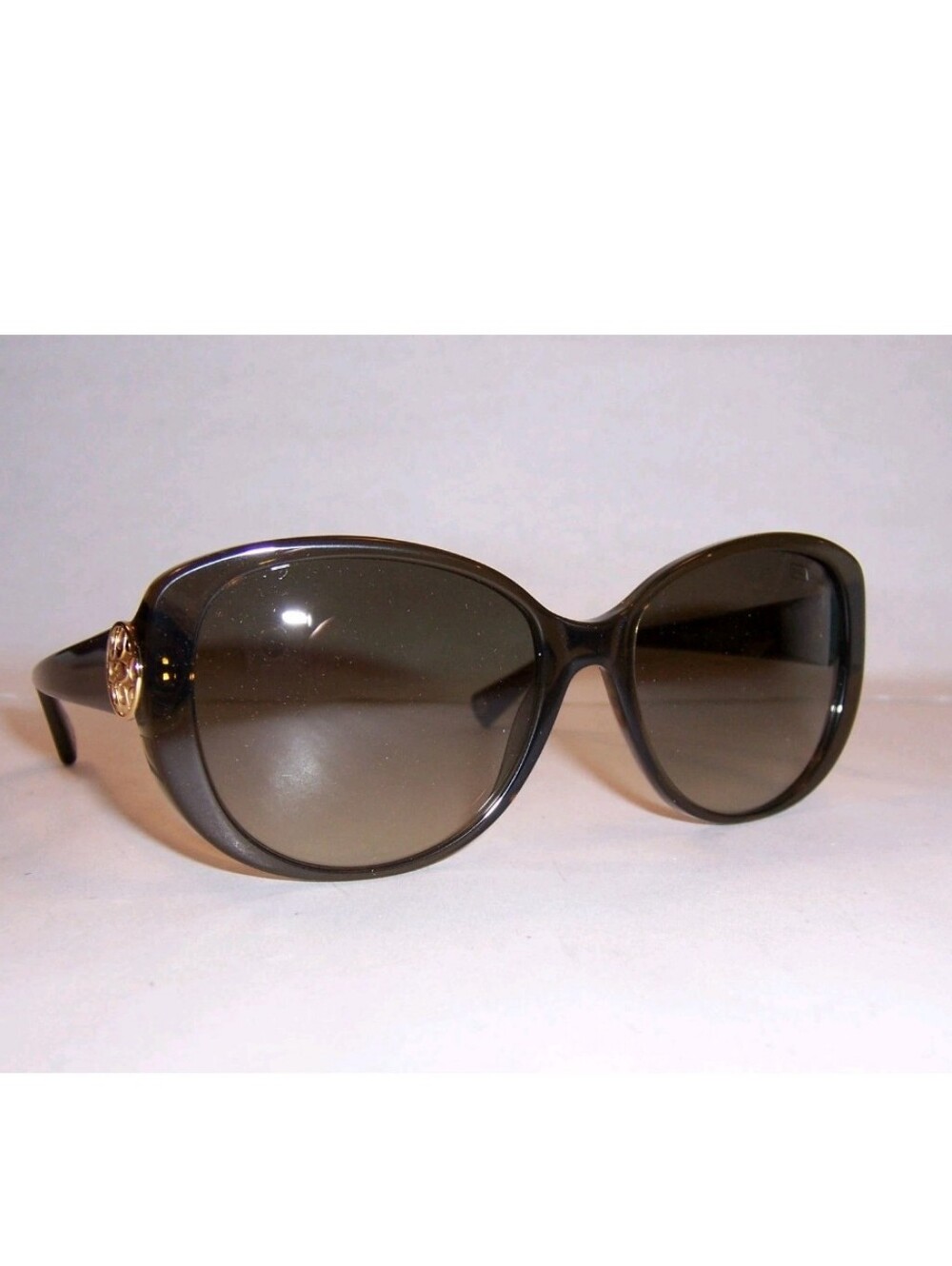 Coach Women's Black Sunglasses with Gold Logo Accent
